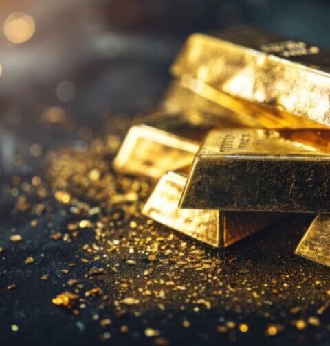 Stack of gold bars on dark background – physical gold bullion symbolizing wealth preservation, gold investment, and the timeless store of value throughout history